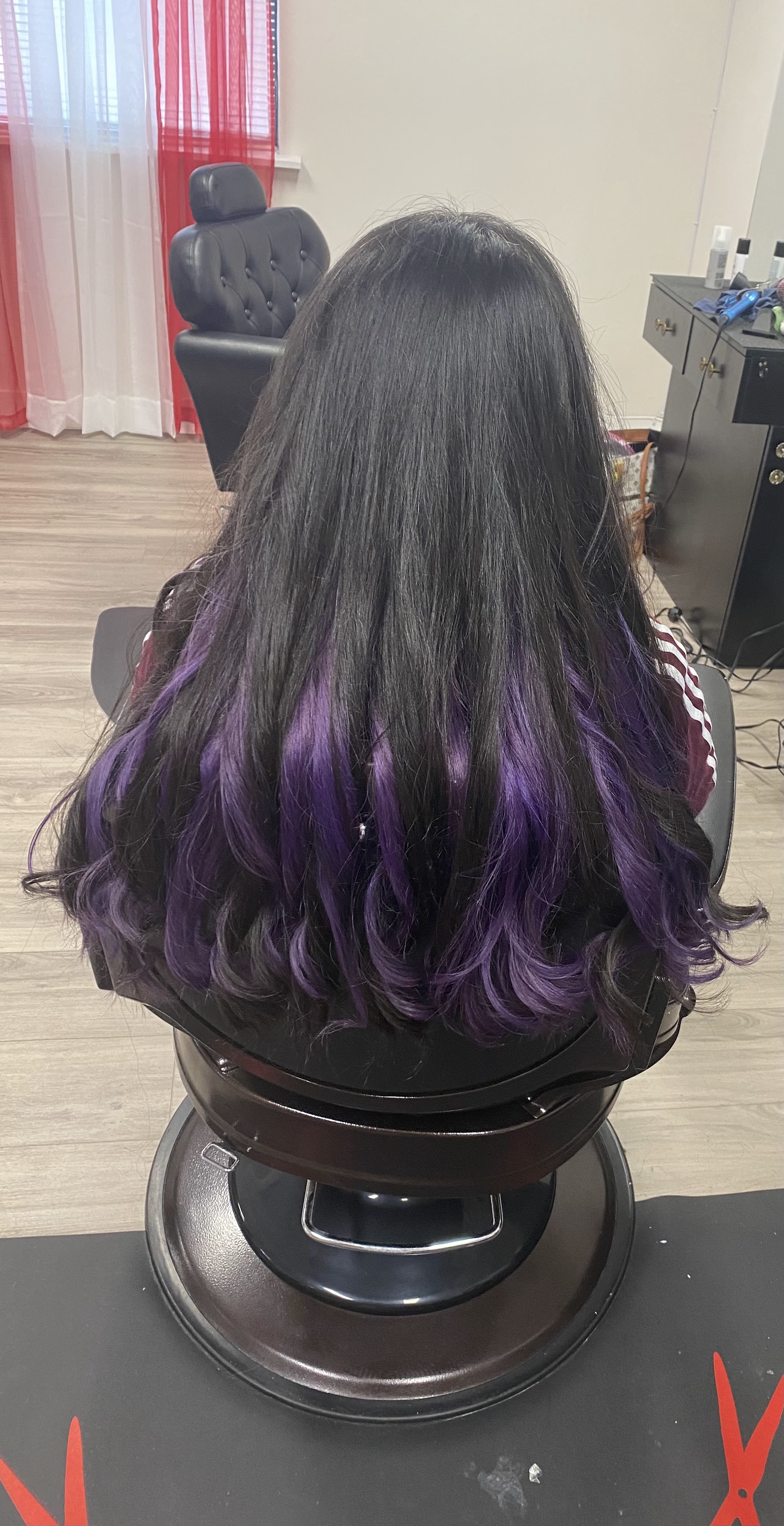 Long dark hair finished with purple tips