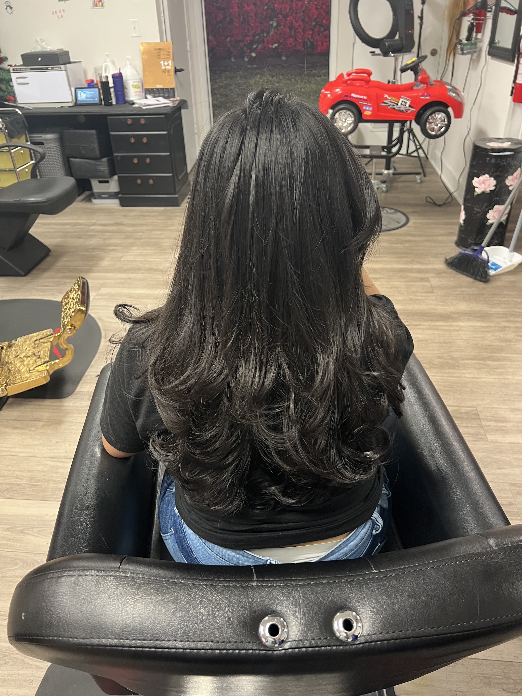 Layered black hair after a cut and blow dry