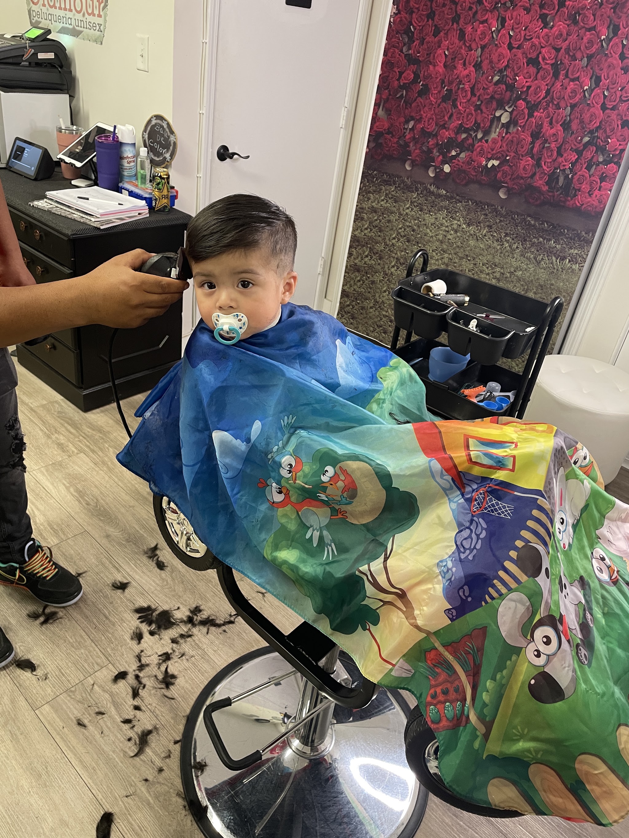 A toddler getting his first haircut